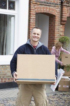 Professional packers organising boxes for a home move in Ealing