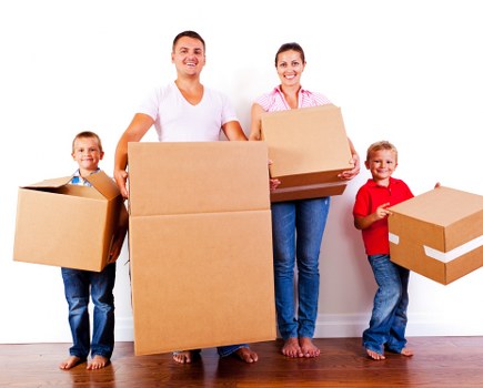 Removal team planning a house move in Ealing with boxes and a van
