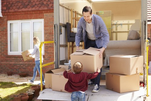 Removal team loading boxes for a home move in Ealing