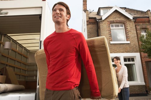 Furniture and household items being loaded into a van in Ealing
