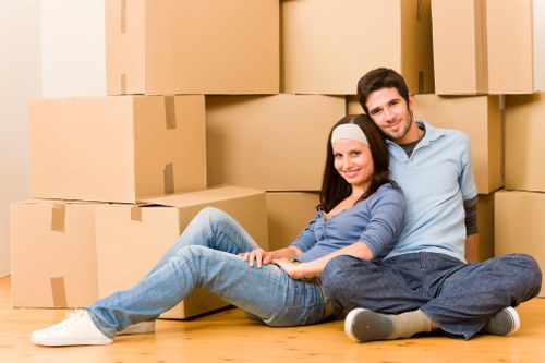 Packed moving boxes and furniture ready for home removals in Ealing