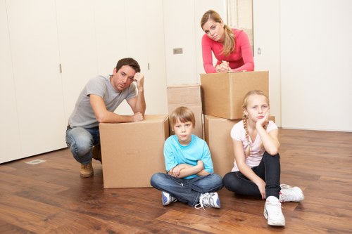 Experienced Ealing removal specialists handling furniture carefully