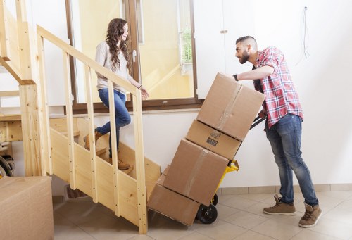 Team handling furniture removal in an Ealing residential street