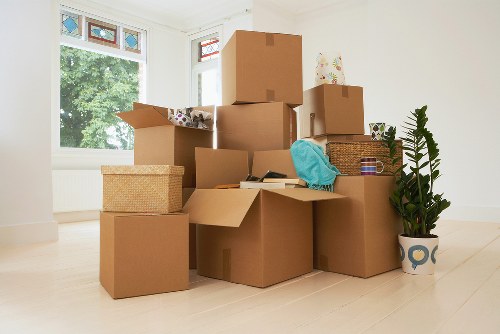 Packed moving boxes ready for transport in Ealing