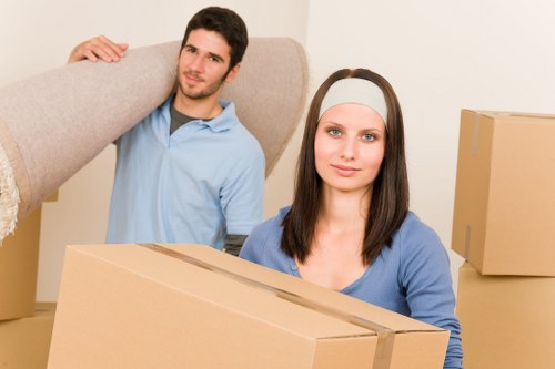Family preparing boxes before a home move in Ealing